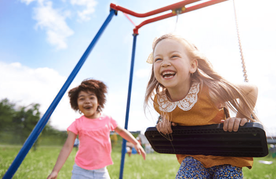kids having fun at a playgrounds by Courts and Greens in Bakersfield