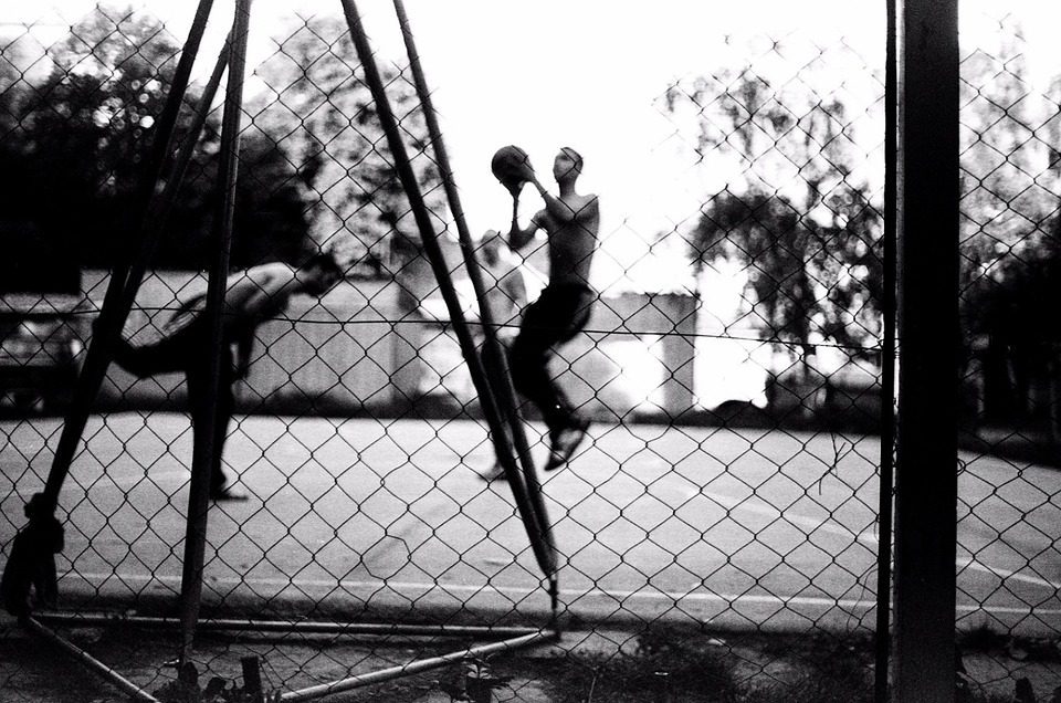 two gents playing ball on a court designed by Courts and Greens in Bakersfield